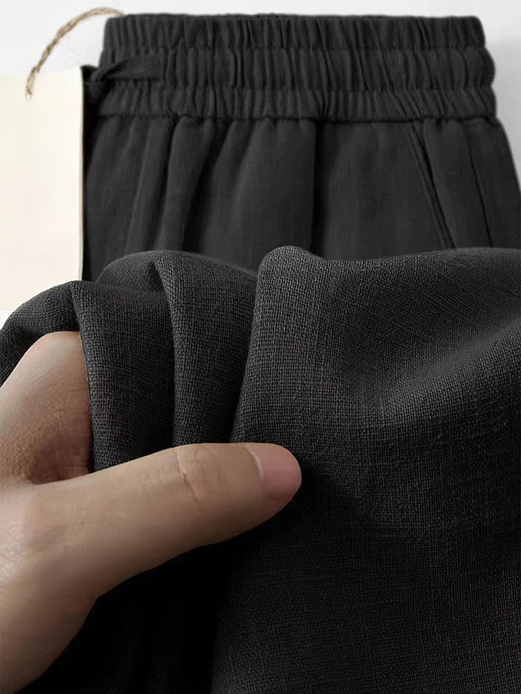 Cropped linen blend pants loose fit pleated details elastic waist relaxed Japanese-inspired silhouette