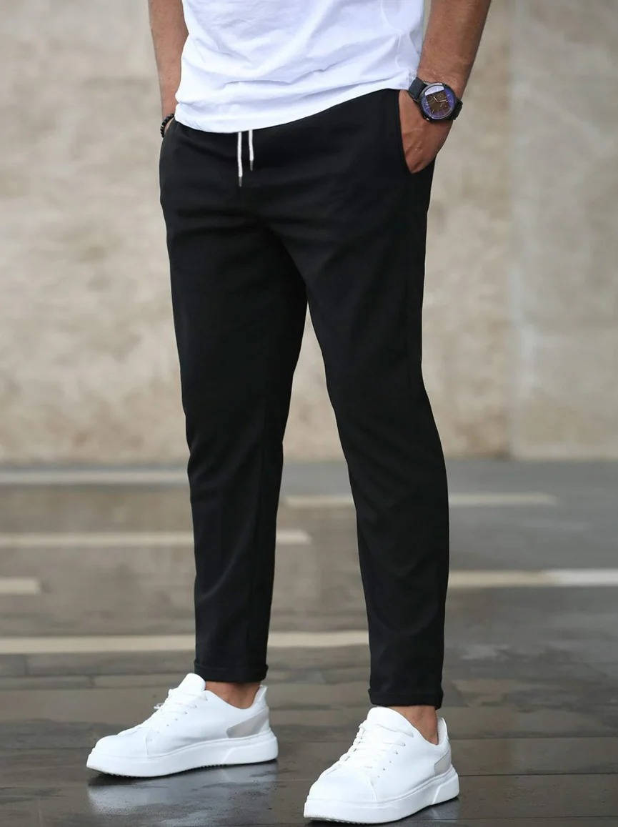 Men's casual stretch pants in neutral tone, slim straight cut with elastic waistband for all-day comfort