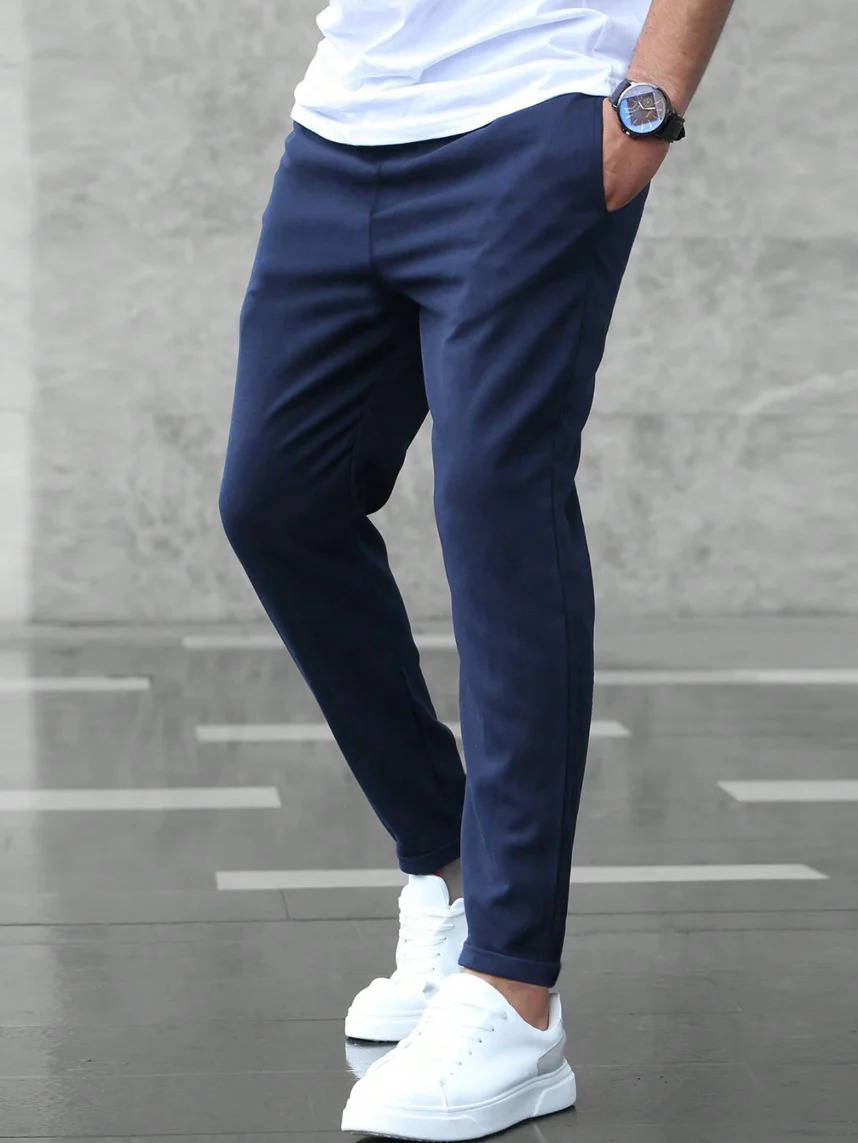Men's casual stretch pants in neutral tone, slim elegant cut with elastic waist for work and weekend