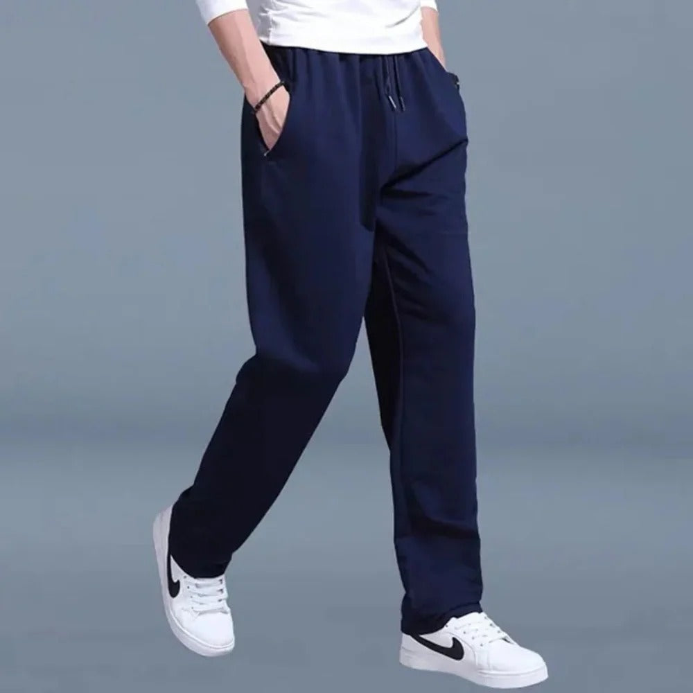 Men's gray cotton-poly blend sweatpants with elastic waist and deep side pockets for everyday wear