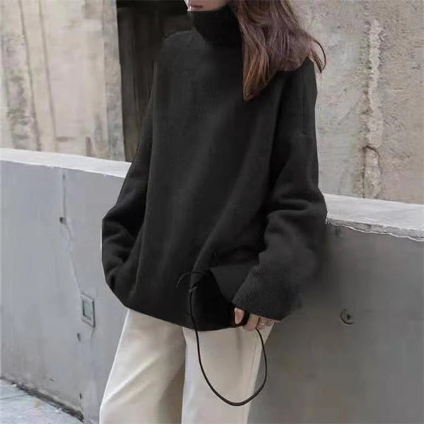 Women's oversized turtleneck wool sweater with ribbed cuffs and hem in cozy neutral tone