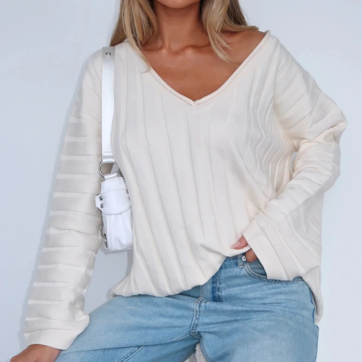 Women's relaxed fit V-neck ribbed wool sweater with long sleeves, cozy knit texture