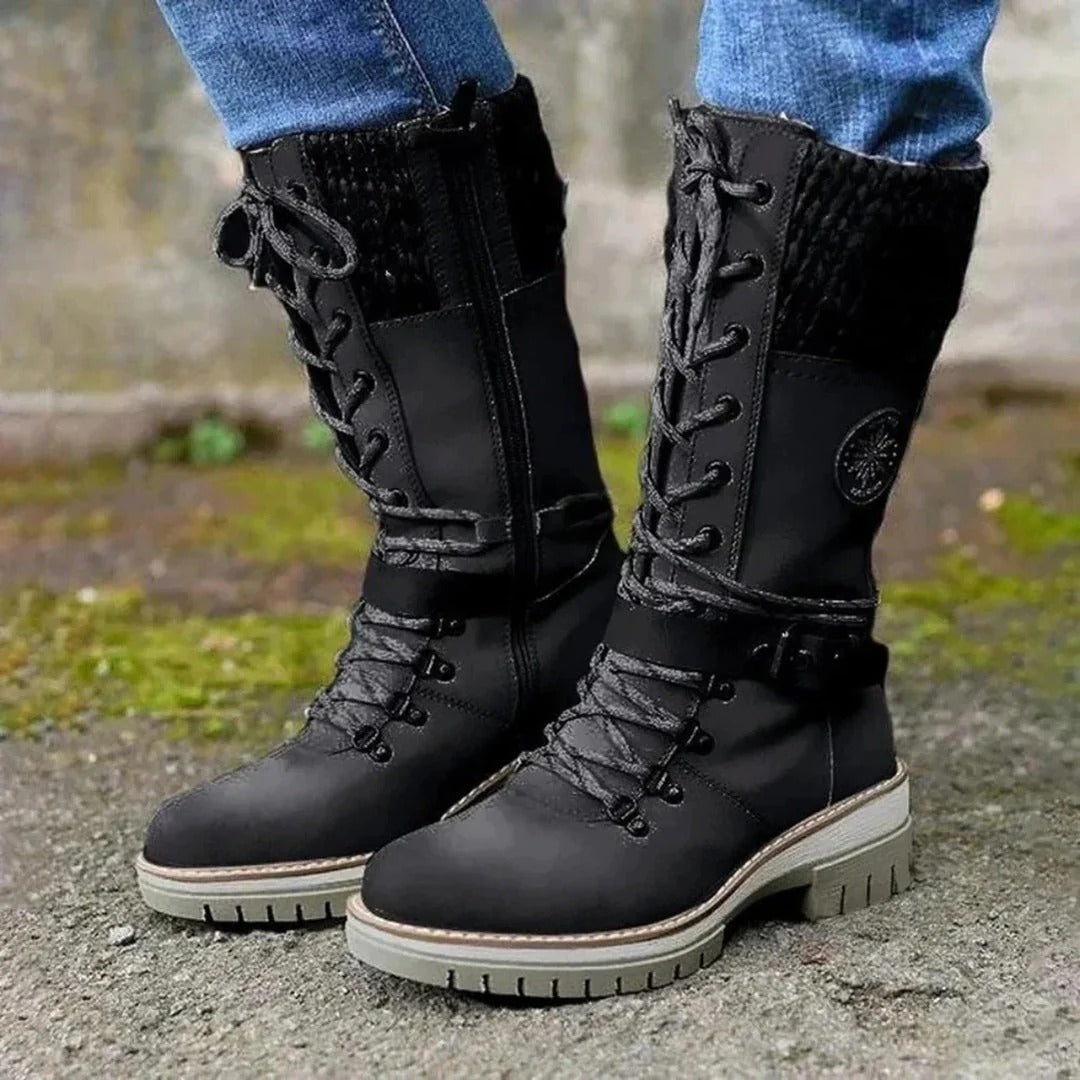 Women's brown knee-high lace-up boots with cuff detail, elegant leg-lengthening silhouette