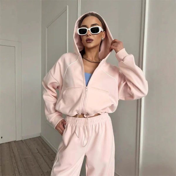 Women's oversized gray two-piece hoodie and pants set with contrast seams and zip-up closure
