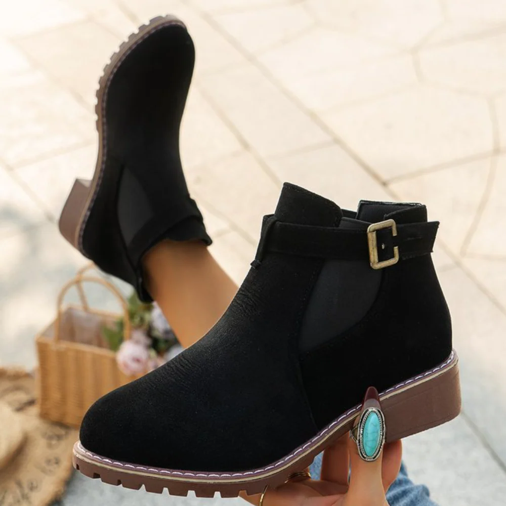 Women's suede-texture ankle boots with buckle strap, elastic panel, and gripped sole for versatile wear