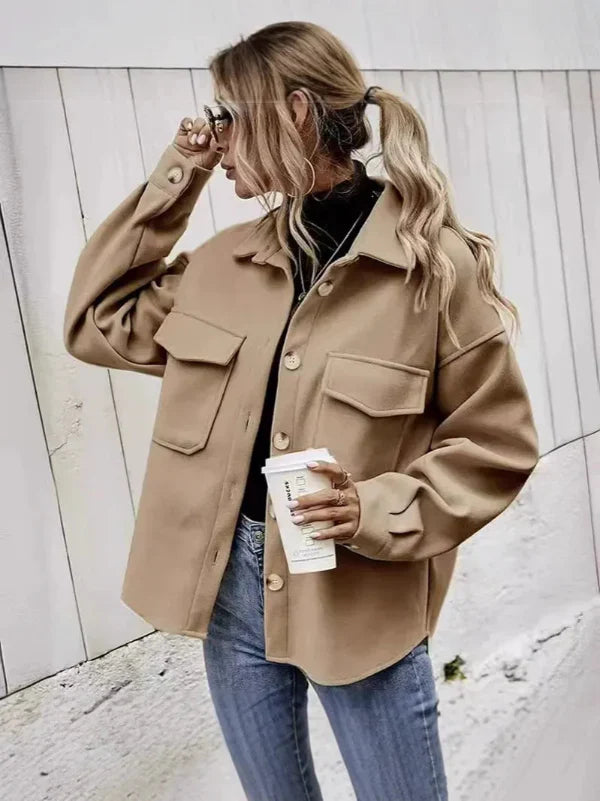 Women's oversized wool coat with button front, notched collar, and flap pockets for a chic look