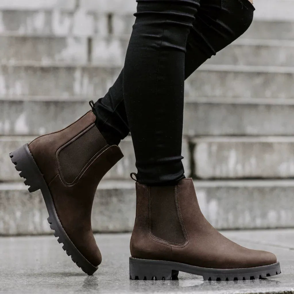 Women's black ankle boots chunky lug sole sleek upper bold contemporary silhouette leg-lengthening