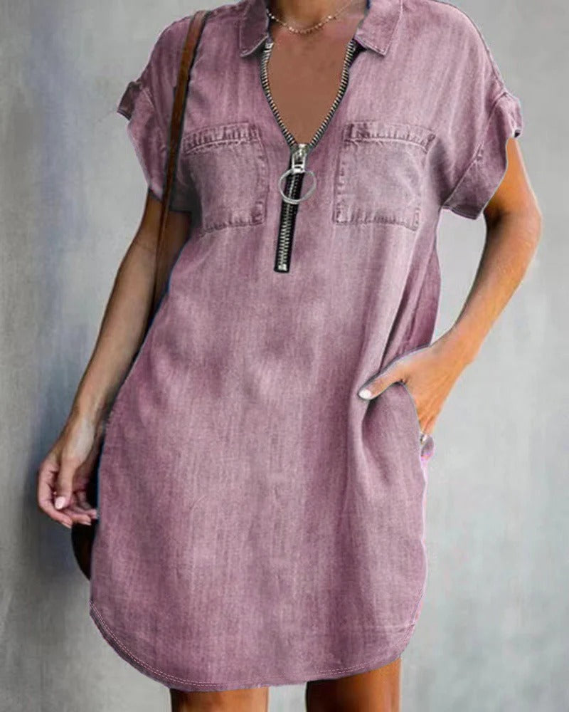 Women's relaxed-fit short sleeve denim dress with front zipper closure and utility pockets