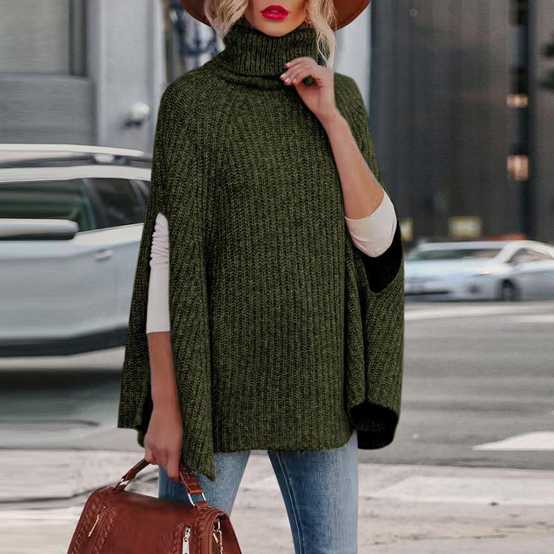Women's wool blend cape in neutral tone, high neck silhouette with arm slits, cozy Nordic-inspired autumn outerwear