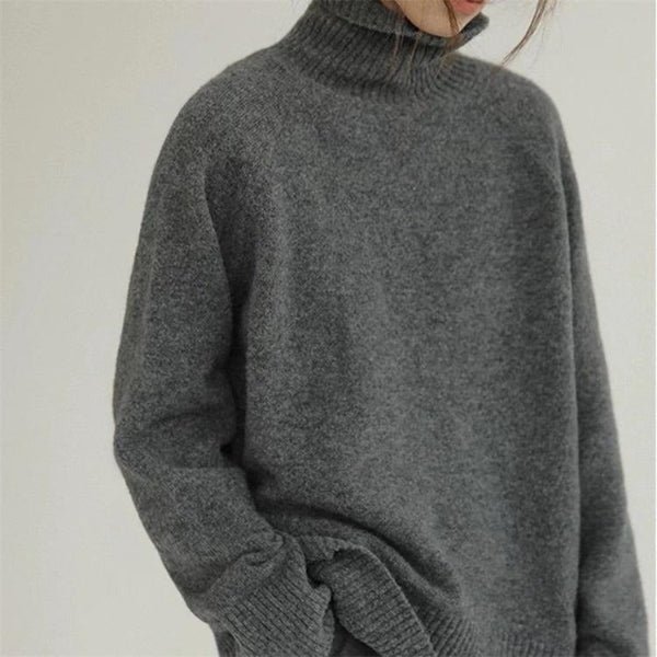 Women's oversized turtleneck wool sweater with ribbed cuffs and hem, cozy soft-knit winter style