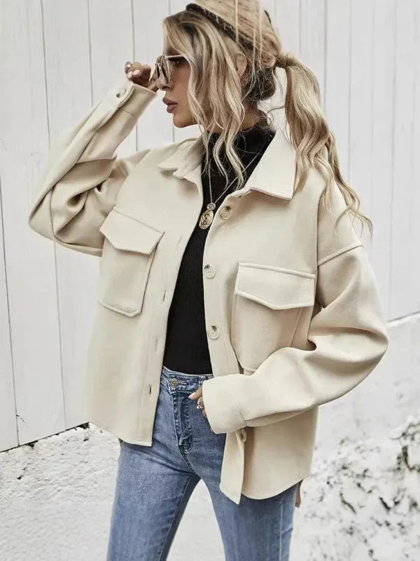 Women's oversized wool coat with button front, notched collar, and flap pockets for a chic look