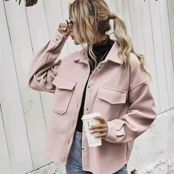 Women's oversized wool coat with notched collar, button front closure, and flap pockets