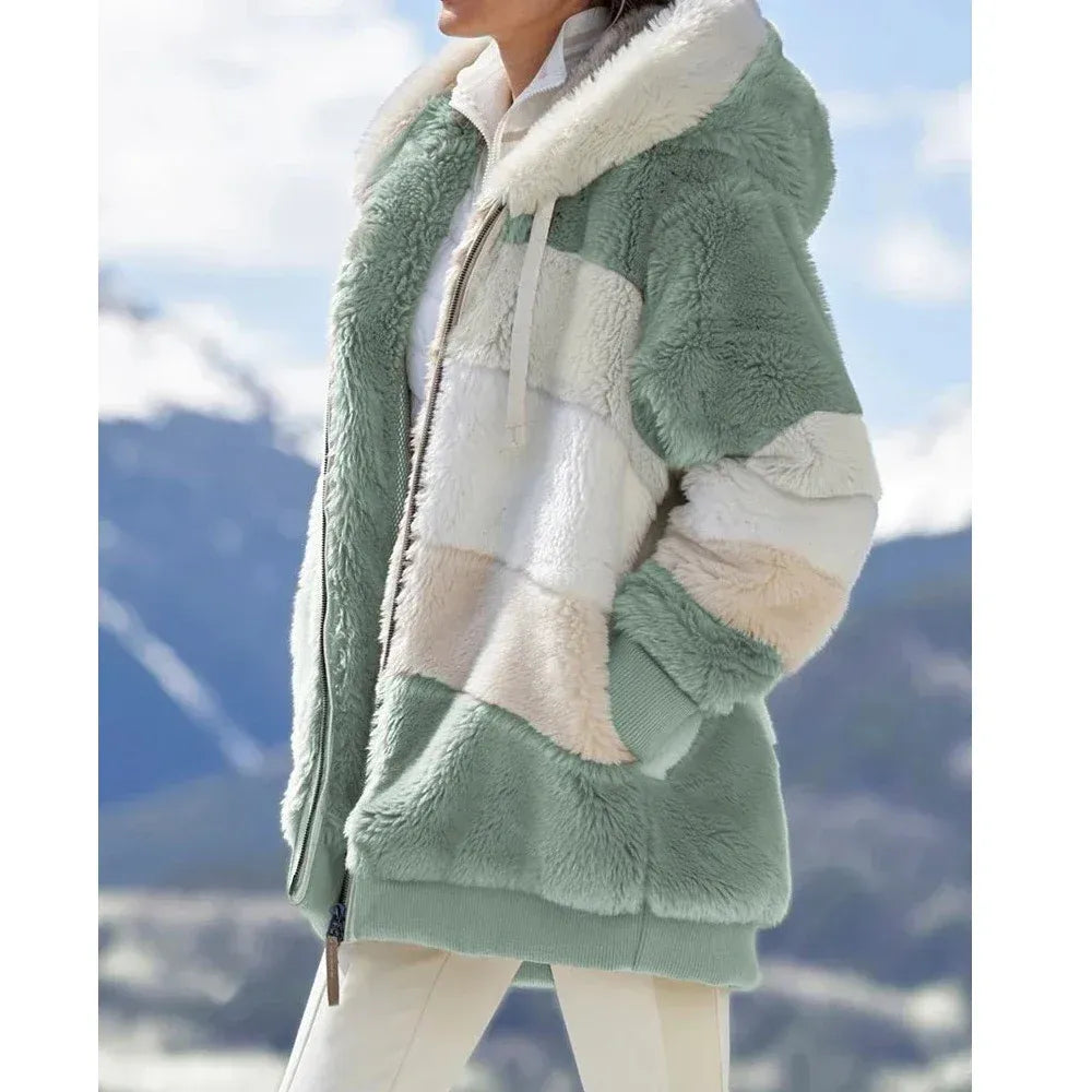 Women's oversized hooded fleece jacket in cozy plush texture with zip front panel design