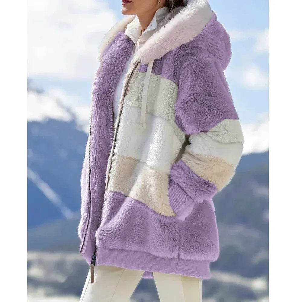 Women's oversized hooded fleece jacket in cozy plush texture with zip front panel design