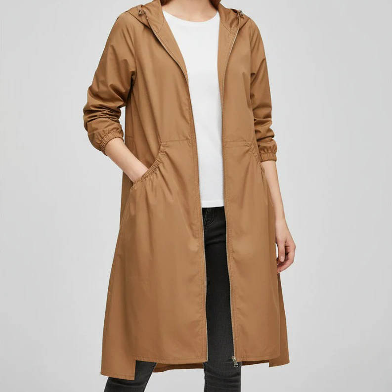 Women's long waterproof jacket in neutral tone, relaxed fit with sealed seams for all-day rain protection
