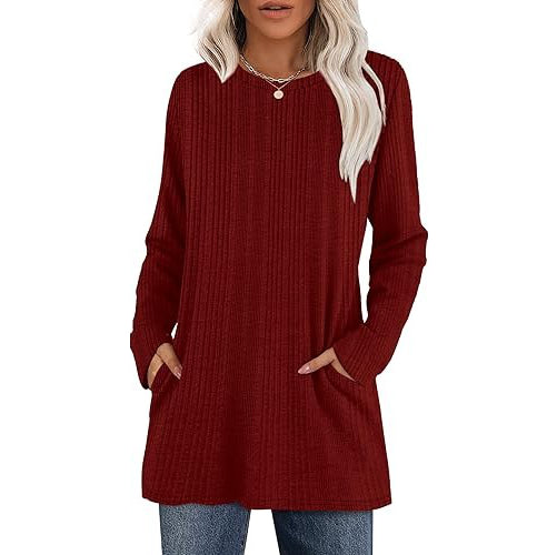 Women's casual hip-length tunic sweater in neutral stretch knit with functional side pockets