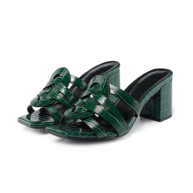 Jade green croc-embossed vegan patent leather mules with polished slip-on silhouette