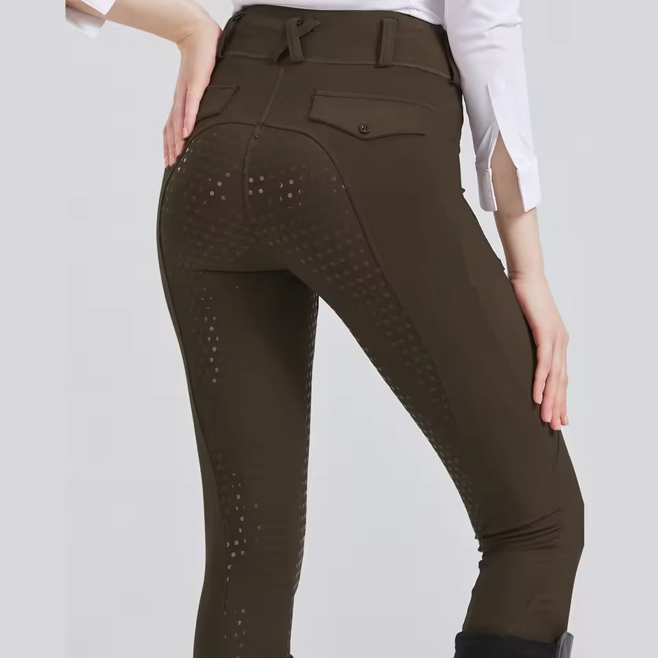 Women's beige equestrian riding pants with full silicone grip from seat to ankle for secure saddle lock