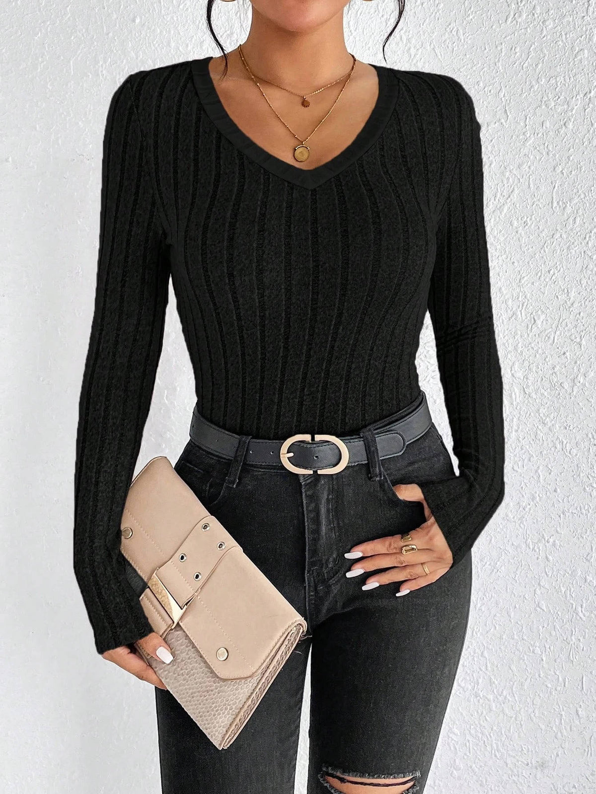 Women's soft ribbed knit V-neck sweater in neutral tone, relaxed everyday essential with vertical texture