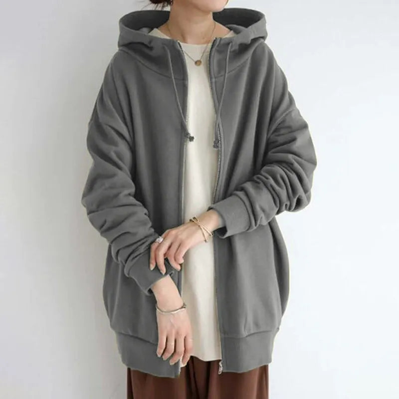 Women's oversized fleece zip-up hoodie in cozy relaxed fit with functional side pockets