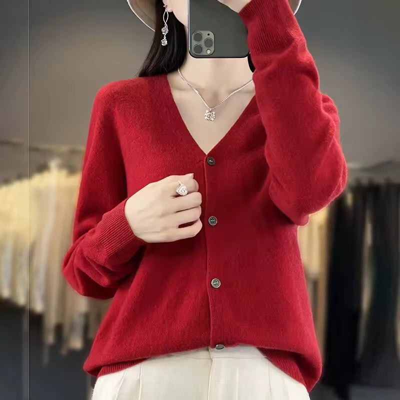 Women's cream wool blend relaxed fit V-neck sweater with button front closure and long sleeves
