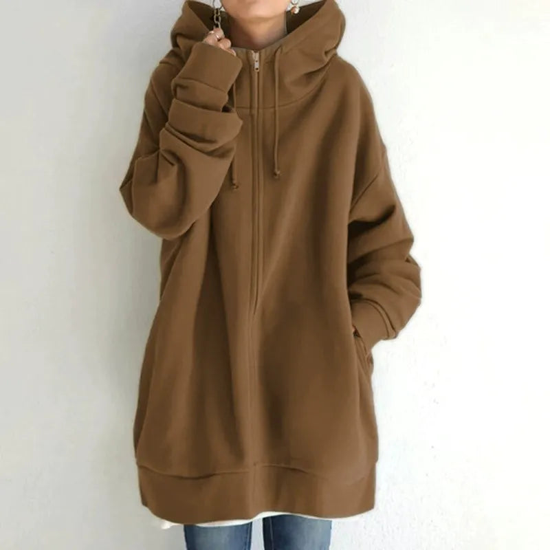 Women's oversized fleece zip-up hoodie in cozy relaxed fit with functional side pockets