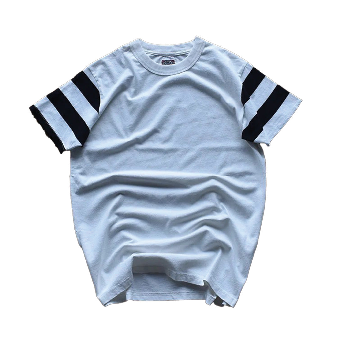 Relaxed-fit striped cotton tee with bold contrast double-stripe sleeves, collegiate streetwear style