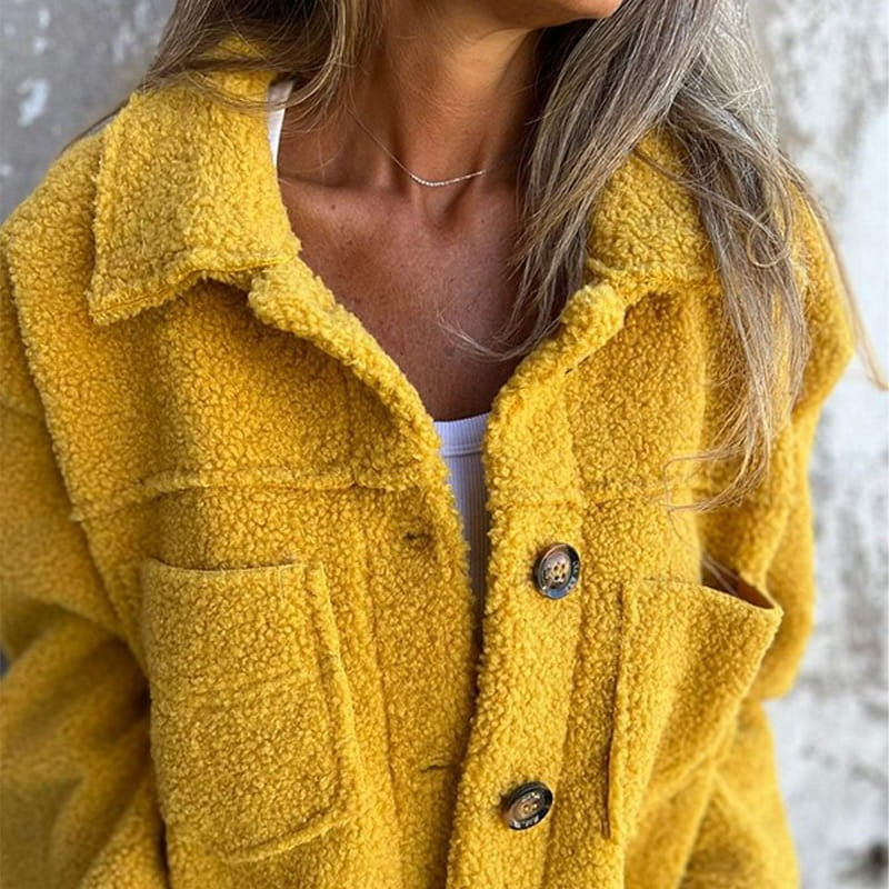 Women's relaxed-fit wool coat with wide lapel, oversized buttons, and patch pockets by Nordisk-Flair