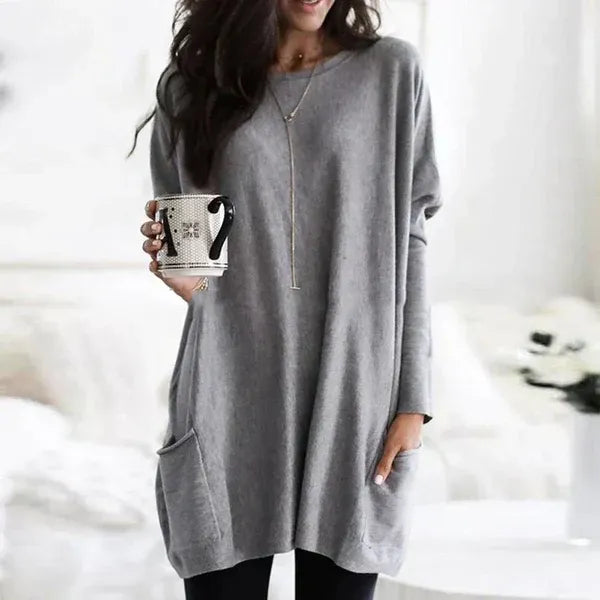 Women's oversized soft knit tunic pullover with dropped shoulders and functional side pockets