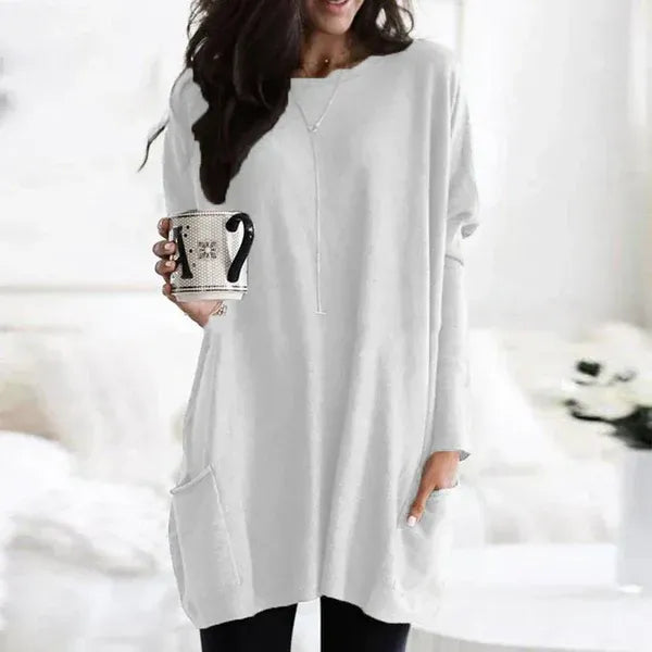Women's oversized soft knit tunic pullover with dropped shoulders, relaxed fit, and side pockets