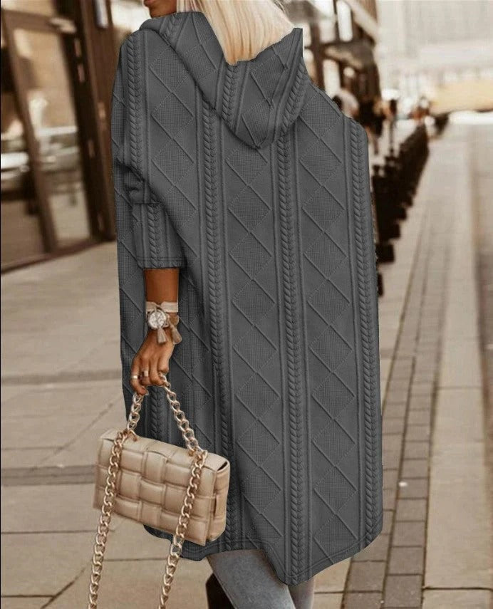 Women's oversized longline hooded cable knit cardigan in neutral wool blend for casual layering