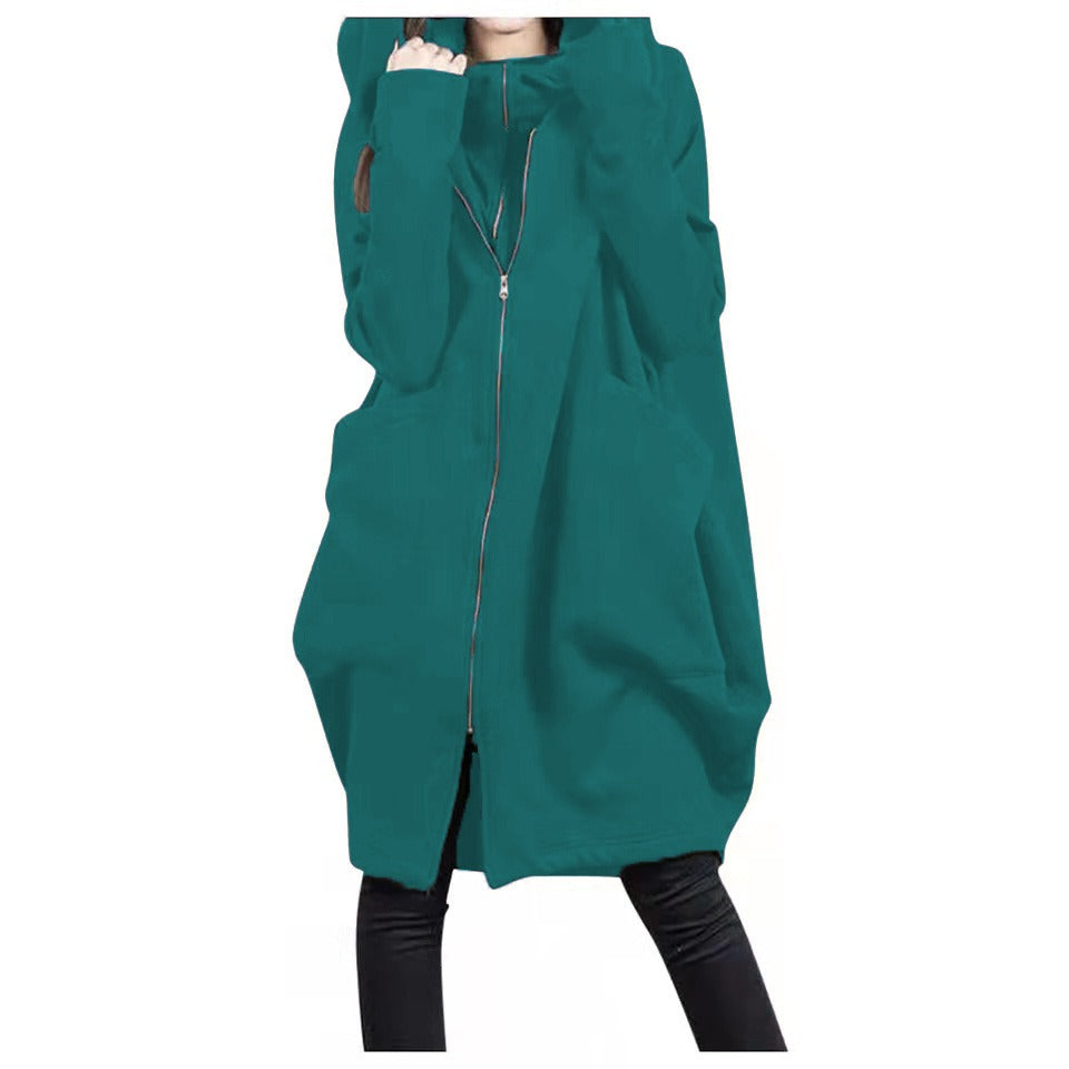 Women's oversized mid-length wool coat with hood, zip front pockets, relaxed silhouette for fall winter