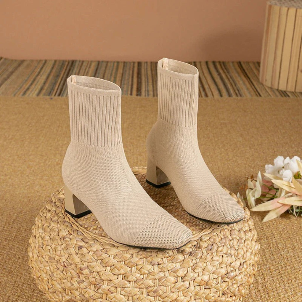 Women's ribbed knit ankle boots in winter style with stretchy textured upper and sleek silhouette