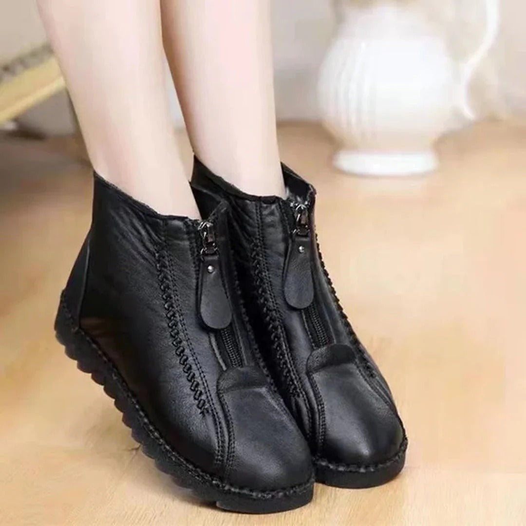 Women's black leather-look ankle boots with chunky sole and front zipper for casual style