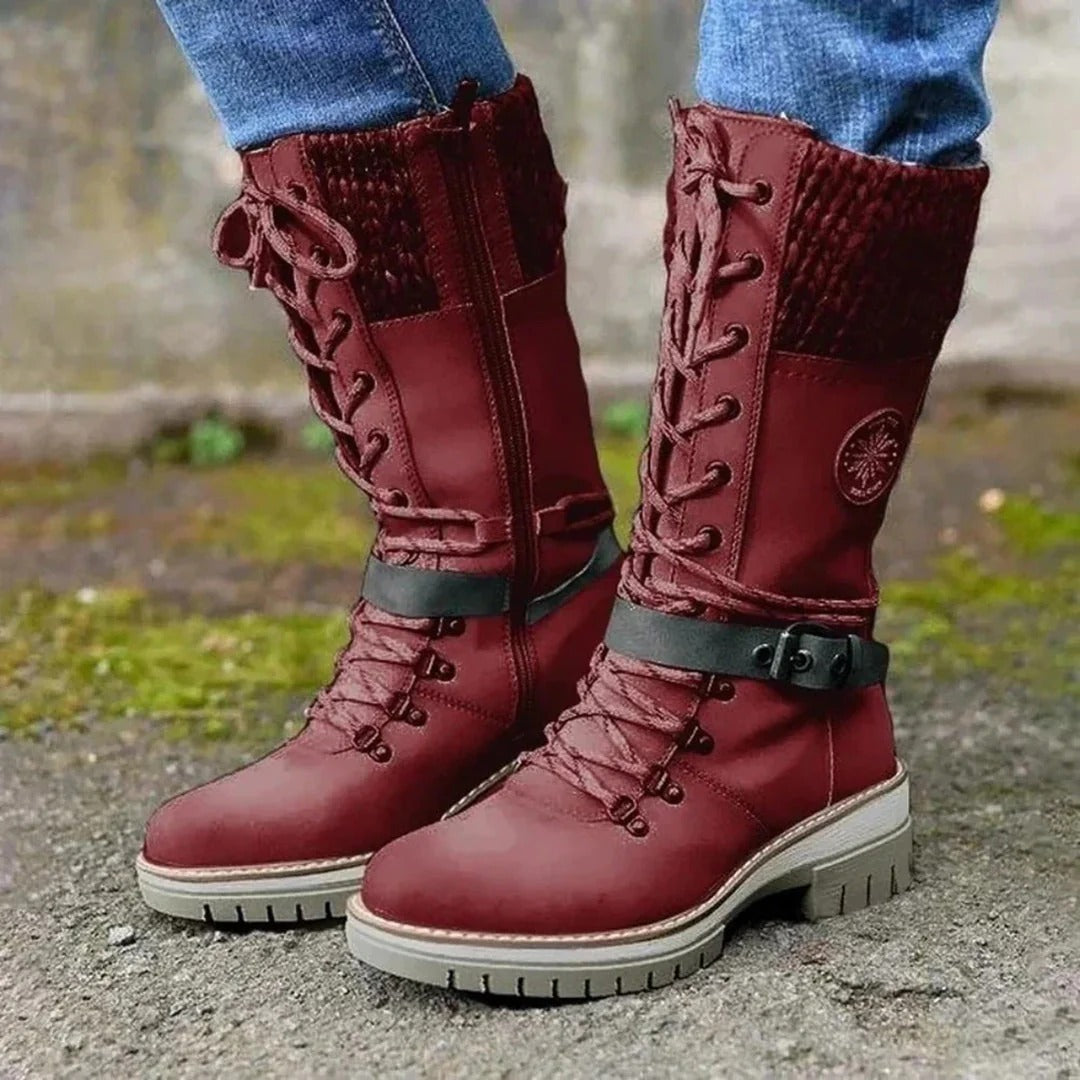 Women's brown knee-high lace-up boots with cuff detail, elegant leg-lengthening silhouette
