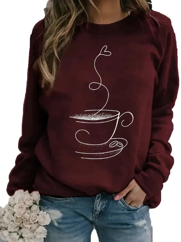 Women's relaxed fit crew neck sweatshirt in neutral tones with playful coffee cup graphic print