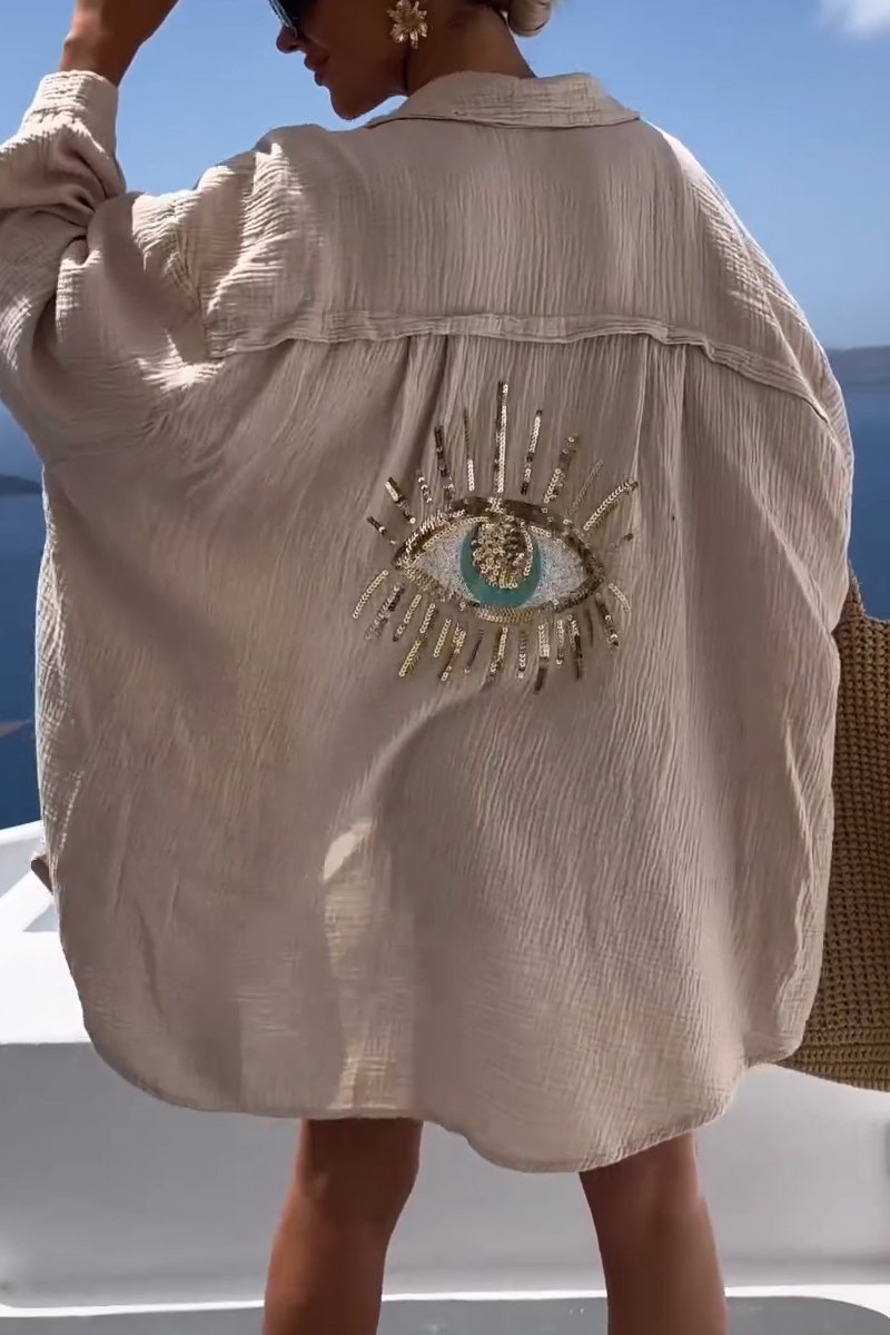 Ivory oversized chic blouse with relaxed silhouette and graceful draping for a polished look