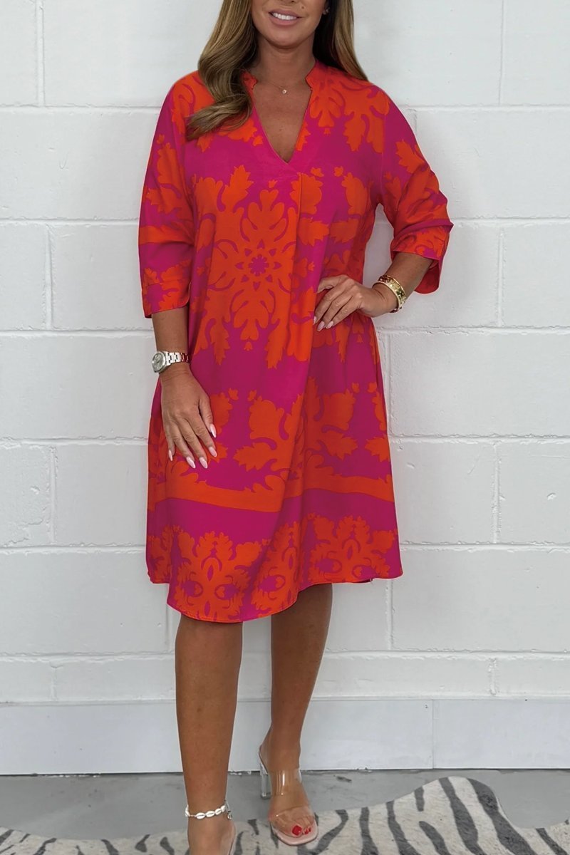 Floral light summer dress with soft V-neckline, flowing silhouette, and delicate feminine pattern