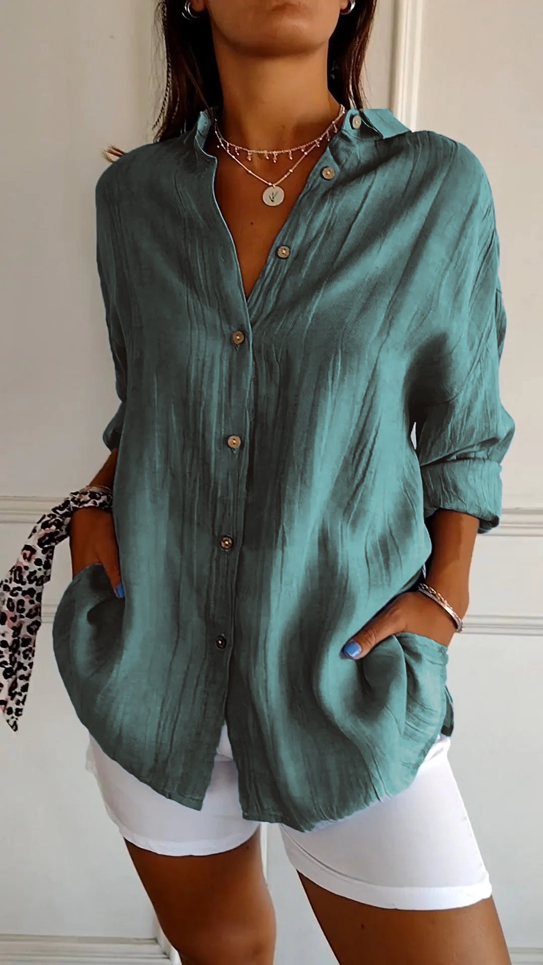Azure blue oversized linen-look women's button-down shirt with wooden-tone buttons and spread collar