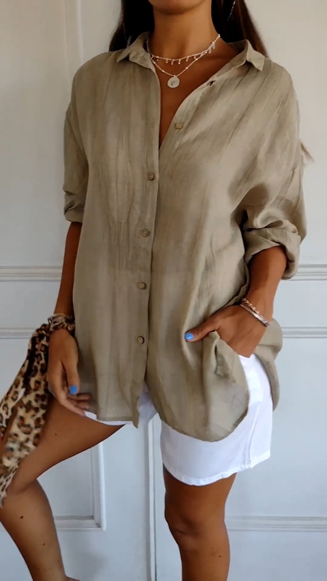 Azure blue oversized linen-look women's shirt with wooden-tone buttons and relaxed long sleeve silhouette