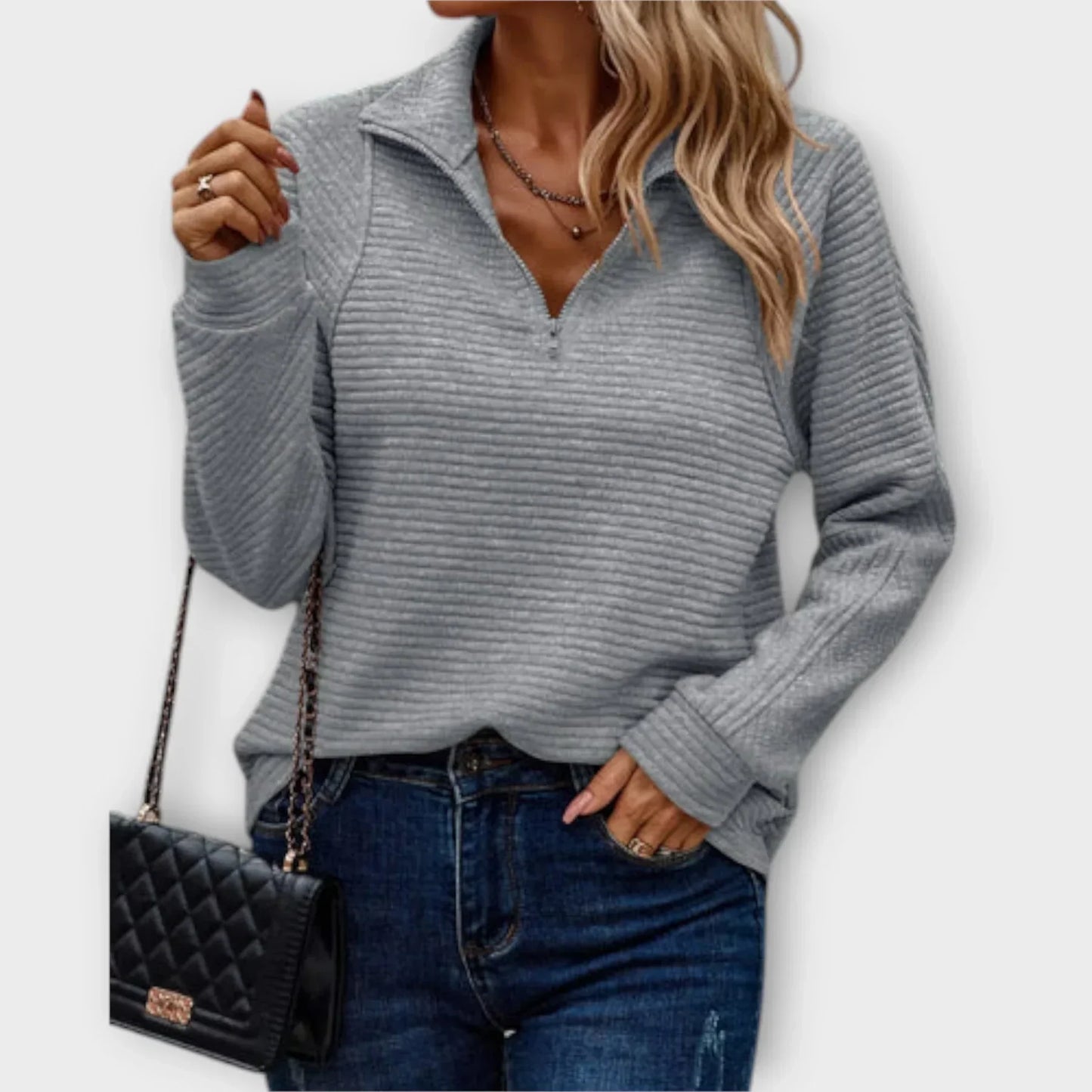 Women's half-zip pullover sweater in neutral tone with adjustable zip neckline for layering