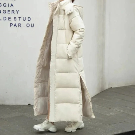 Women's long quilted hooded parka in insulated lightweight design with horizontal panel stitching