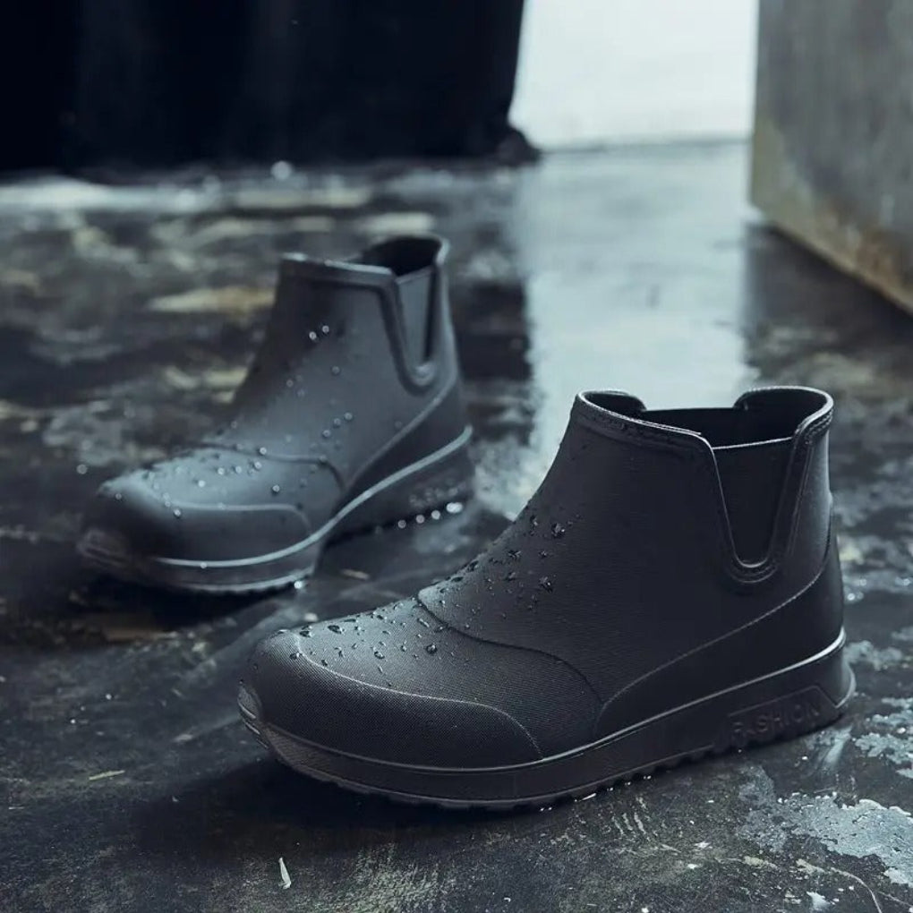 Women's black waterproof Chelsea boots with sleek ankle silhouette and elastic side panels for winter