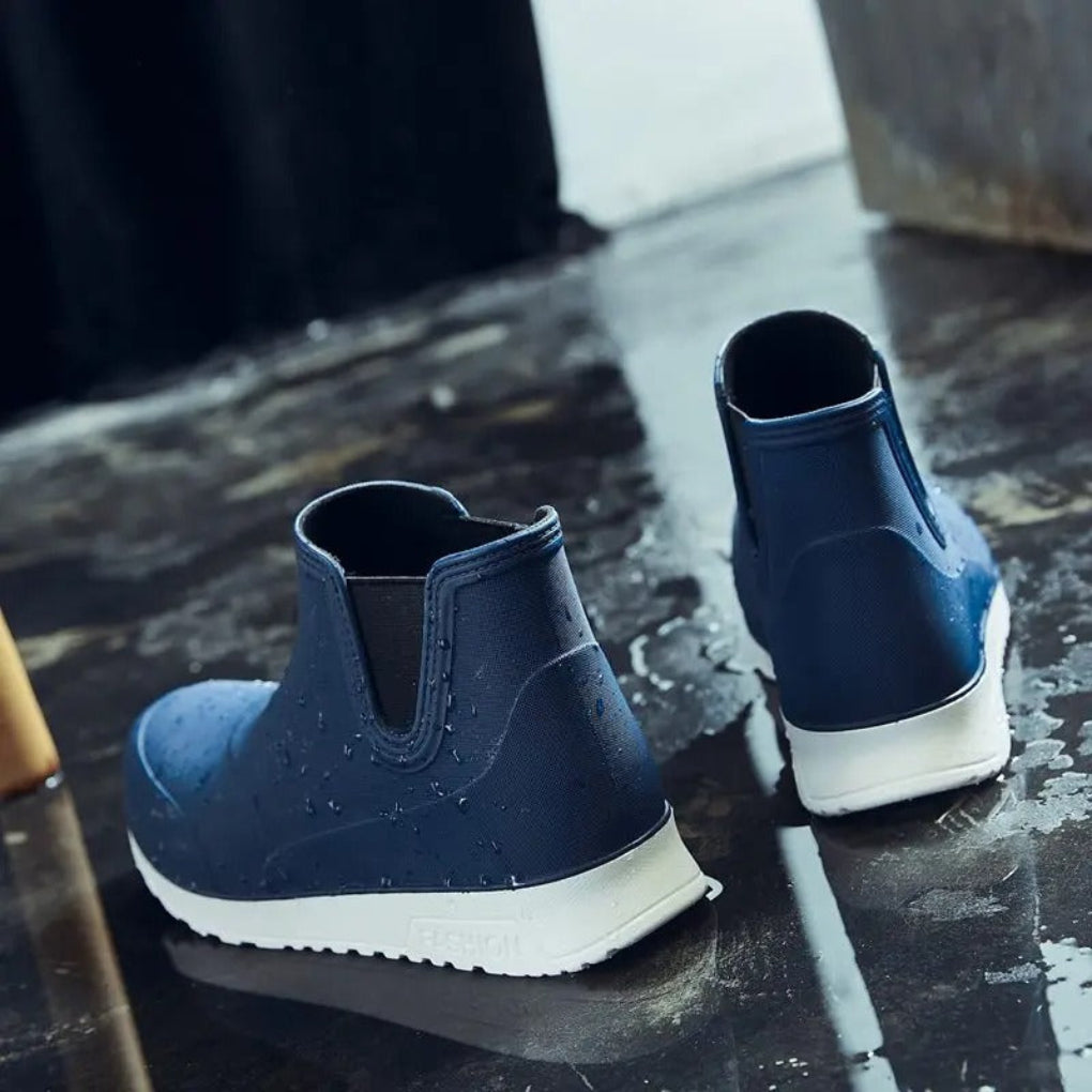 Women's black waterproof Chelsea boots with sleek ankle silhouette and elastic side panels for winter