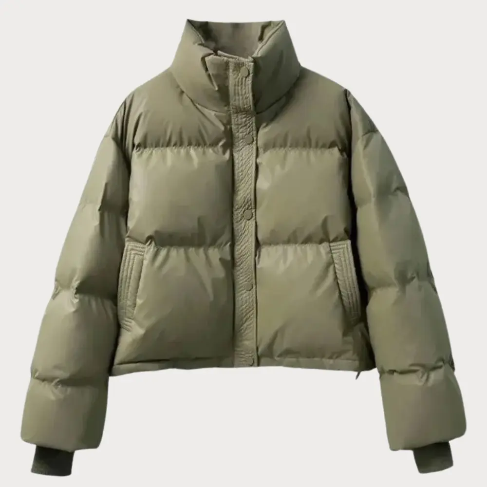 Cropped puffer jacket in neutral tone with zip-up closure, lightweight warm layering piece for streetwear