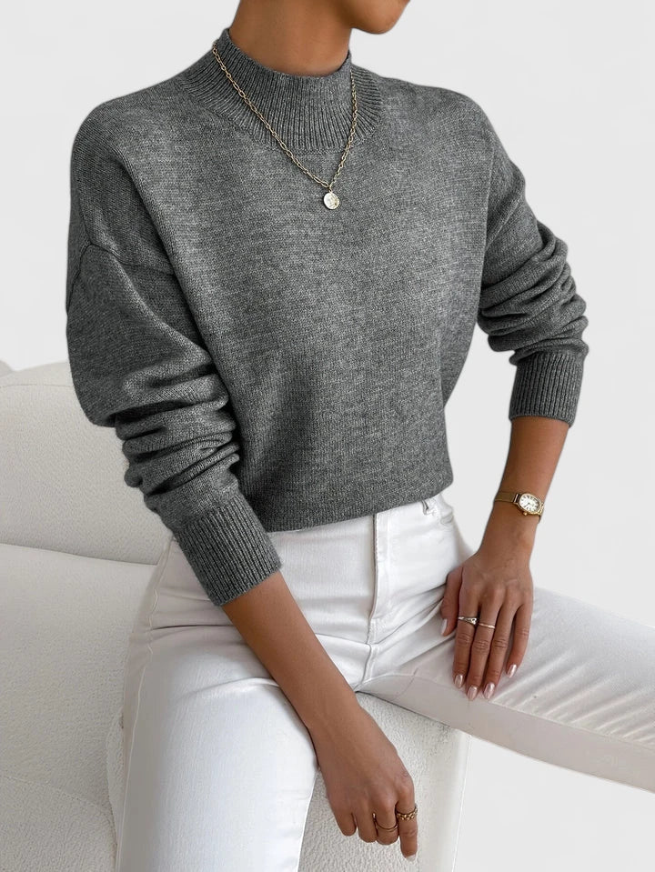 Elegant cream turtleneck sweater with classic high-neck design and soft breathable knit fabric