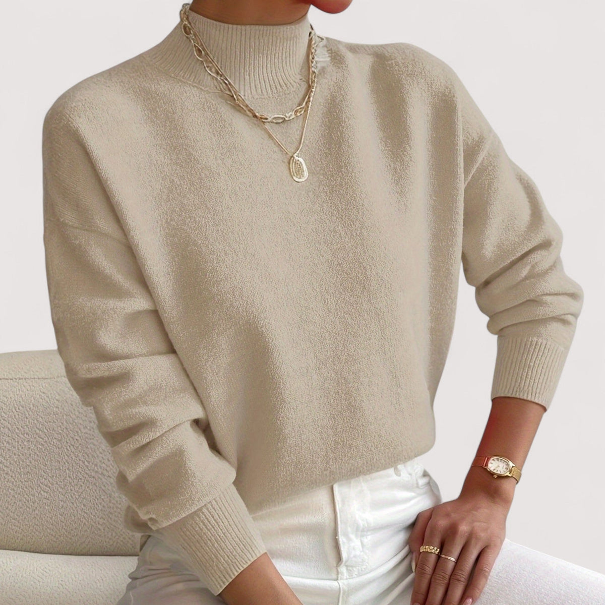 Elegant cream turtleneck sweater with flattering slim fit and elongating neckline design