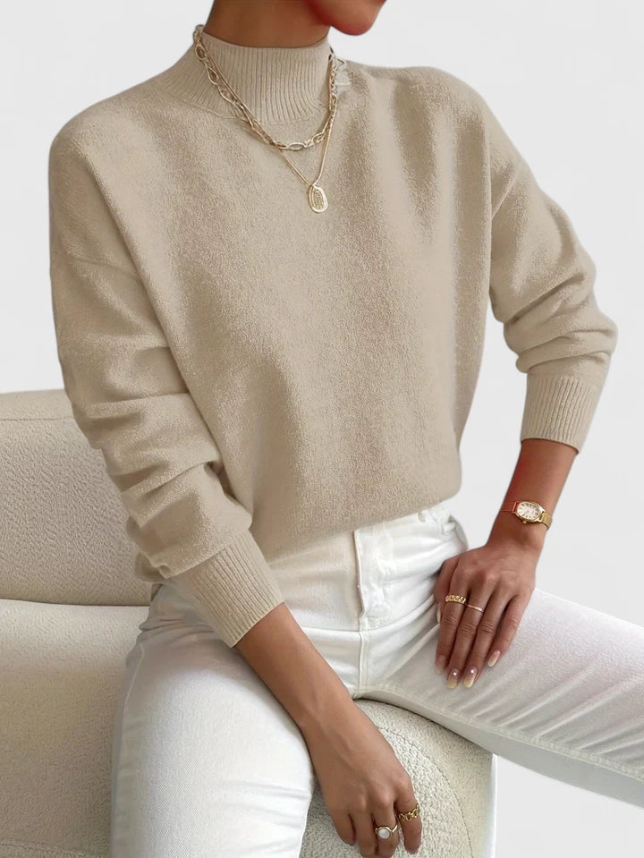 Elegant cream turtleneck sweater with classic high-neck design and soft breathable fabric for layering