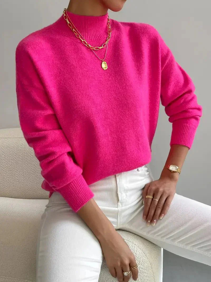 Elegant cream turtleneck sweater with slim flattering fit and classic ribbed neckline detail