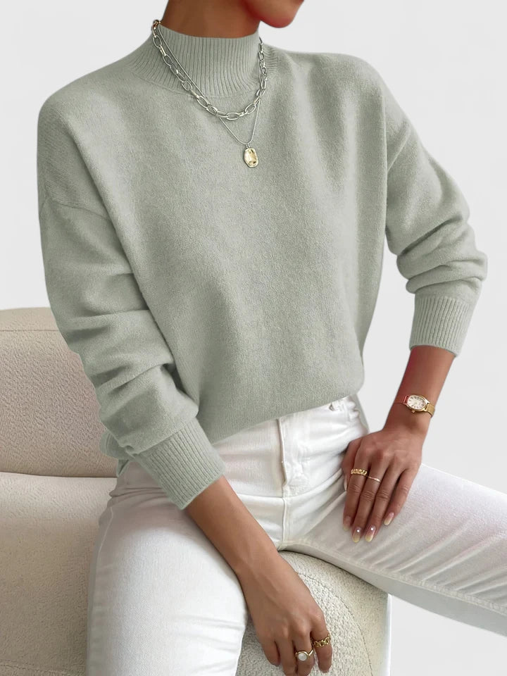 Elegant cream turtleneck sweater with classic high-neck design and soft breathable fabric for timeless style